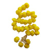 Yellow pom-pom Diwali door hanging with a gold decorative cap, white sprigs and yellow floral tassels at the base.