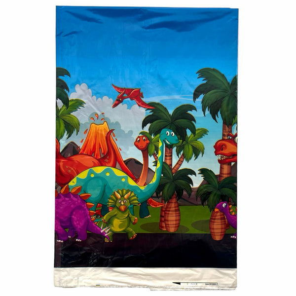 Packaged jungle plastic table cover showing dinosaurs, tropical trees and a volcano in a colourful landscape for a themed party.
