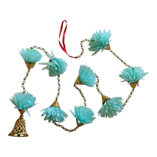 Light blue floral Diwali door hanging with gold cone accents, white and gold beads and a decorative bell at the end.