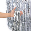 Metallic Foil Fringe Party Curtain Backdrop, 7 Colours, Silver for creating a reflective background behind a cake table or party photo area.