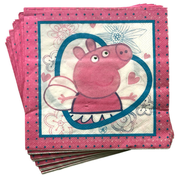Folded Peppa Pig napkins showing a central character illustration with decorative details and a pink dotted border for a themed birthday table.
