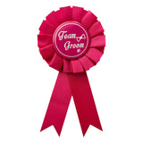 Pink Team Groom rosette badge with decorative ribbon tails from Funzoop The Party Shop