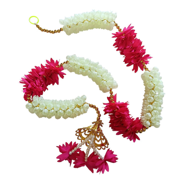 Pink and white floral Diwali door hanging with gold beads, a decorative cap and dangling pink flower tassels.