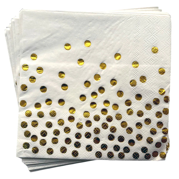 Folded glossy paper napkins showing gold toned polka dots on a white background, with the pattern concentrated near the lower edge.