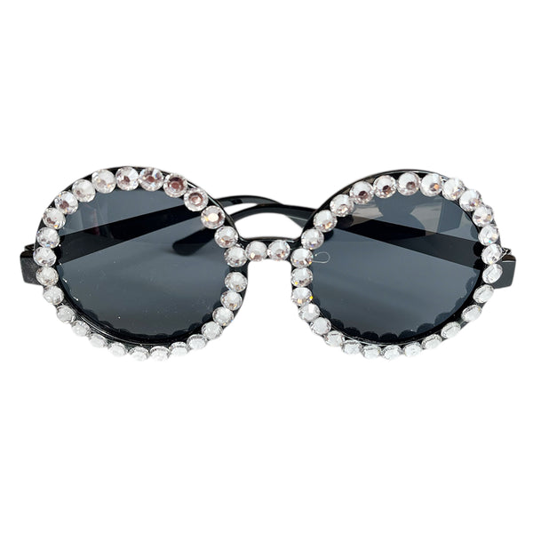 Black round plastic party goggles with a circular novelty frame, providing a simple wearable accessory for retro portraits and birthday photo corners.