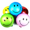 Yellow round smiley face foil balloon with black eyes and a curved smile shown as a product reference for themed parties and celebration displays, with its themed design visible.