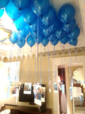 Blue metallic helium balloons arranged for ceiling decoration, done by Funzoop Party Store