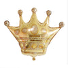 Gold crown shaped foil balloon shown as a product reference for royal-themed birthdays and celebrations and a coordinated party display.