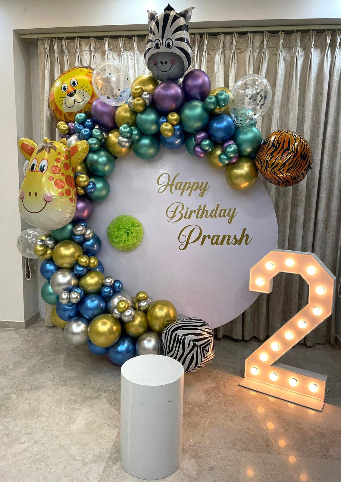 Jungle theme balloon arch decoration with illuminated LED milestone number from Funzoop The Party Shop