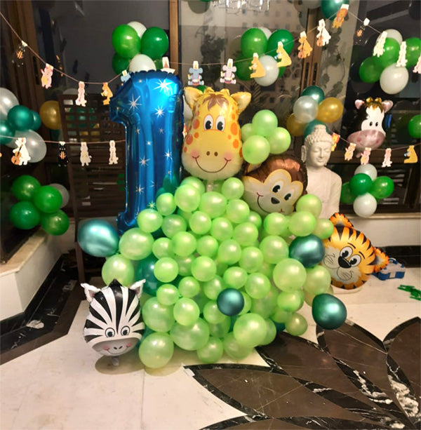 Jungle Theme Birthday Milestone Balloons Decor, in an event decoration layout for a themed celebration and party photographs.