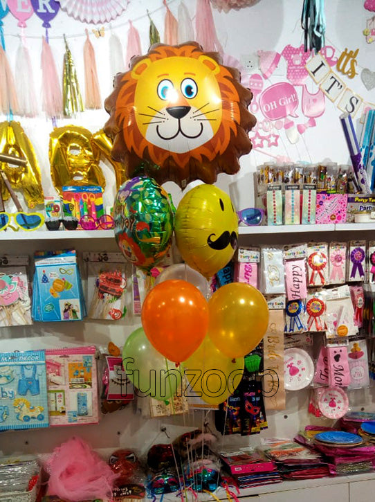 Lovable Lion Mustache Foil Balloons Helium Inflated Bouquet shown in a styling reference for animal-themed birthdays and safari celebrations, with extra decorations separate from this listing.