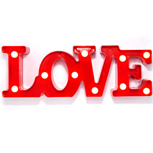 LOVE Decor LED Sign, as a decorative lighting accent for a themed party table or display area.