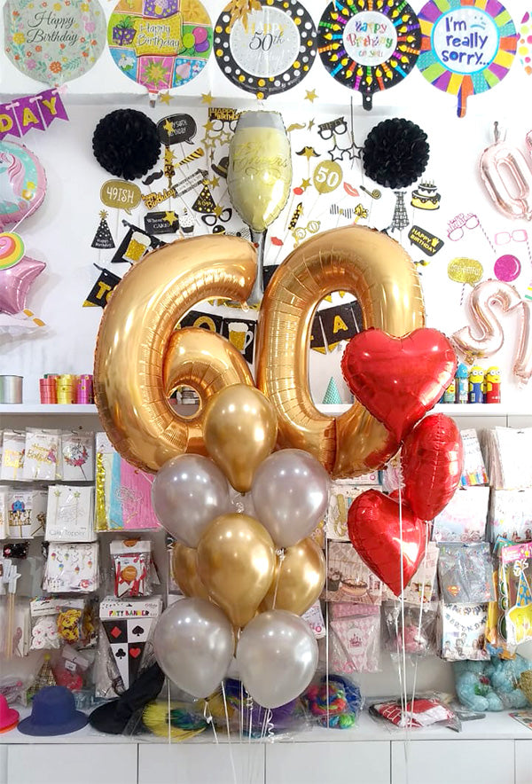 Helium-inflated 60 number balloon bouquet with red foil hearts and assorted latex balloons