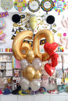 Helium-inflated 60 number balloon bouquet with red foil hearts and assorted latex balloons