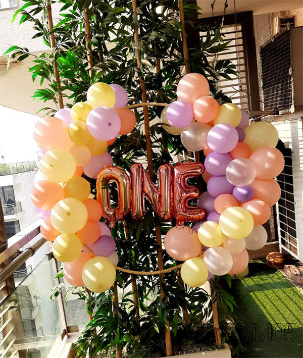 First Birthday Balloon Wreath, in an event decoration layout for a themed celebration and party photographs.