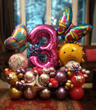 Pink butterfly balloon centrepiece customised with the number three for a birthday sold by Funzoop Birthday Shop.