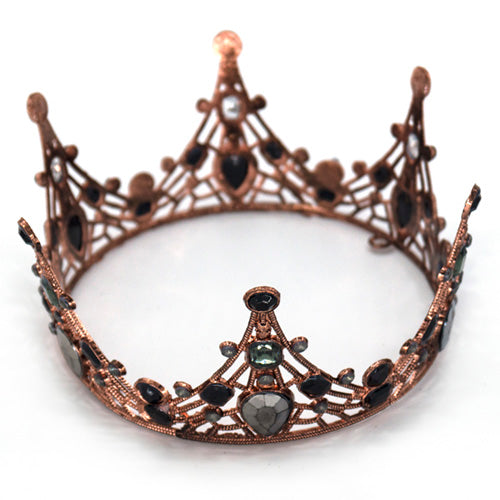 Rose gold plastic tiara crown with rhinestone embellishments and a metallic finish, providing a decorative head accessory for bridal and princess portraits.
