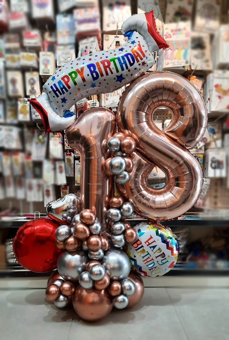 Rose gold birthday balloon centerpiece with number balloons and Happy Birthday banner by Funzoop, Gurgaon
