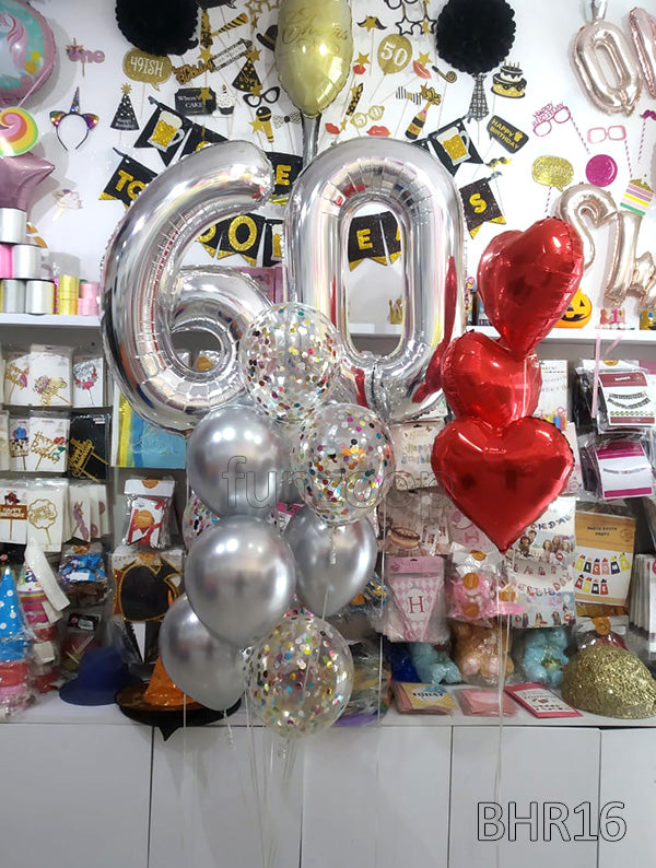 Silver 60 number balloons with silver and confetti balloons beside three red heart foil balloons.