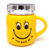 Smiley Yellow "You Make Me" Mug with lid, with the ceramic body and matching lid forming a coordinated novelty drinkware design.