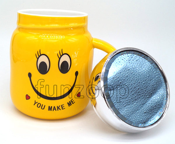 Smiley Yellow "You Make Me" Mug with open lid, with the ceramic body and matching lid forming a coordinated novelty drinkware design.